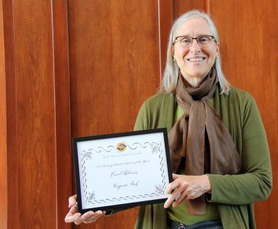 Carol Robinson holds the certificate she earned as national advisor of the year for the Health Professional Student Association.