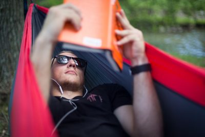 Student reading in hammock