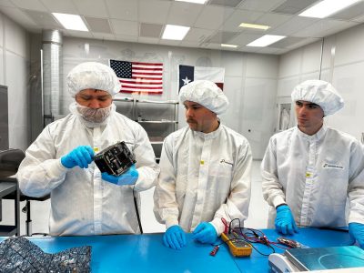 people working on satellite