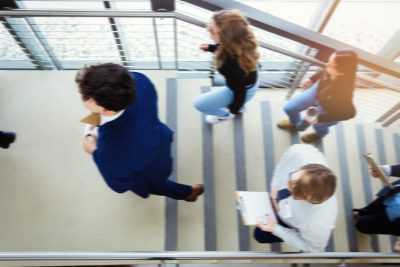 Prospective students walking up a staircase on their way to interviews. 