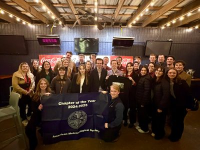 Meteorology Club members posing with banner