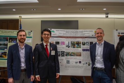 Faculty and a student at recent event in Richmond.